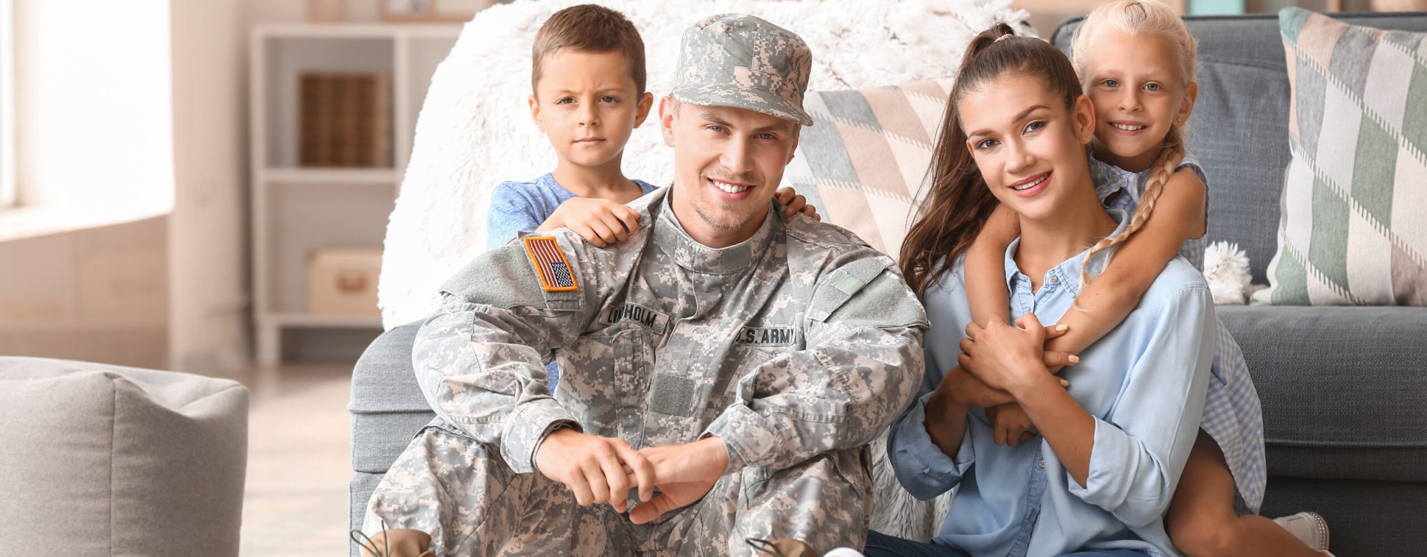 Happy military man with his family at home